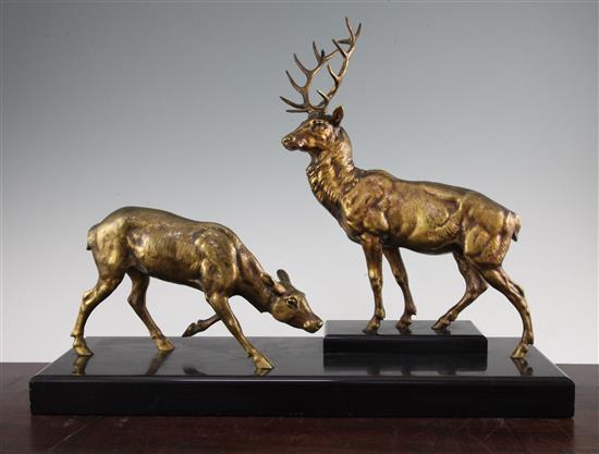 Jules Edmond Masson. A patinated bronze figure group of a stag and doe, 20in.